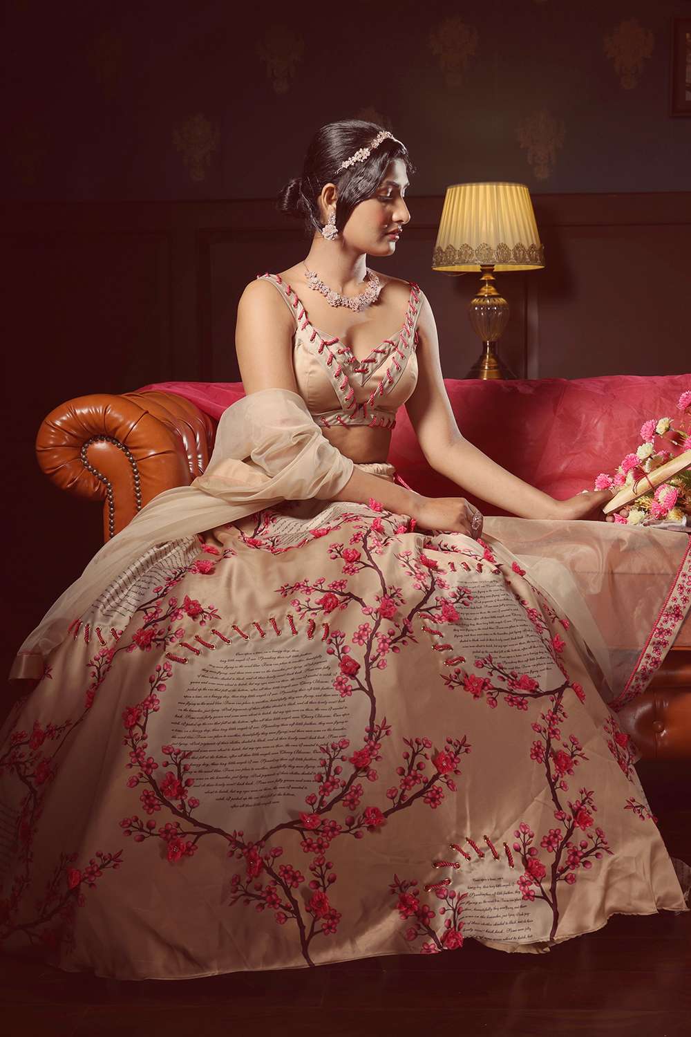 Printed lehenga with 3D flowers & rope detail, eyelet blouse, and an open dupatta