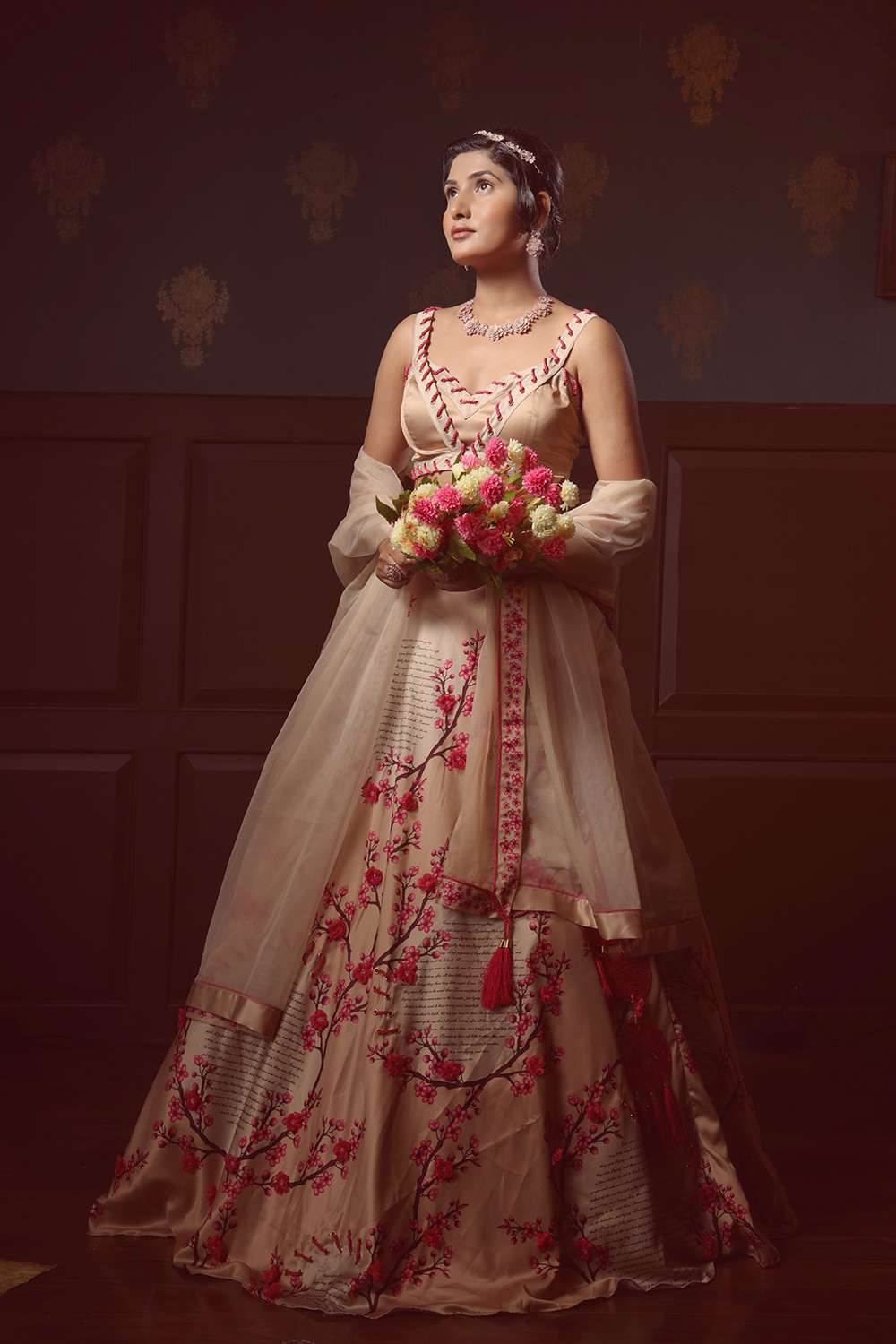 Printed lehenga with 3D flowers & rope detail, eyelet blouse, and an open dupatta